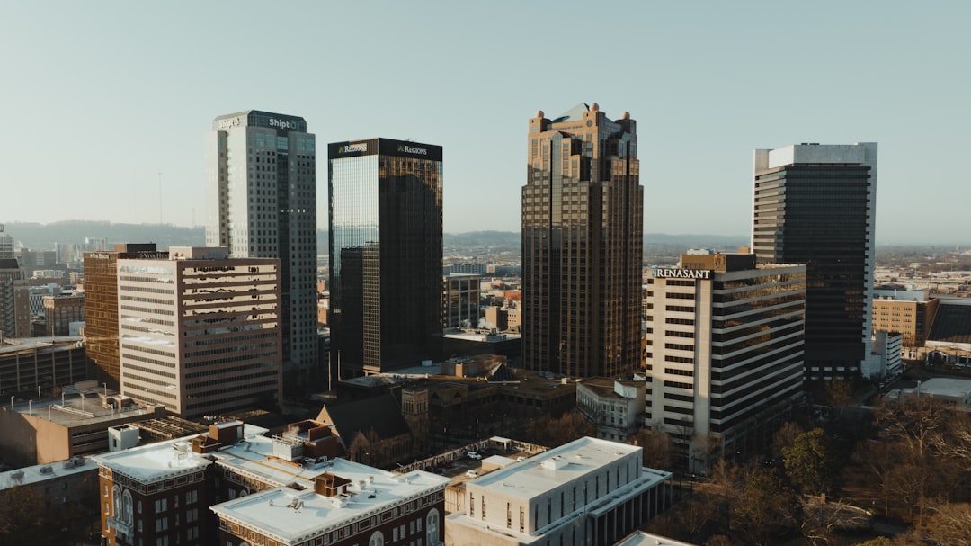 A bar chart comparing estimated cost per square foot across Birmingham, Huntsville, Mobile, Montgomery, and Tuscaloosa