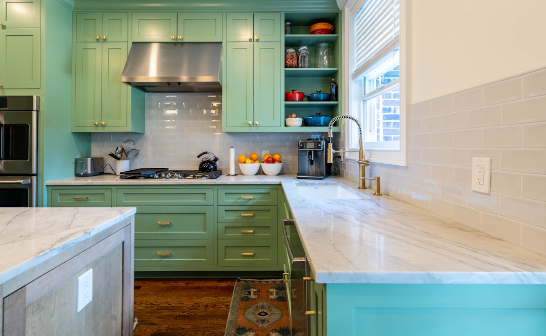 Interior photo concept showing a split comparison of builder-grade vs higher-end kitchen and finish packages