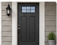 Black painted front door with simple trim and siding.